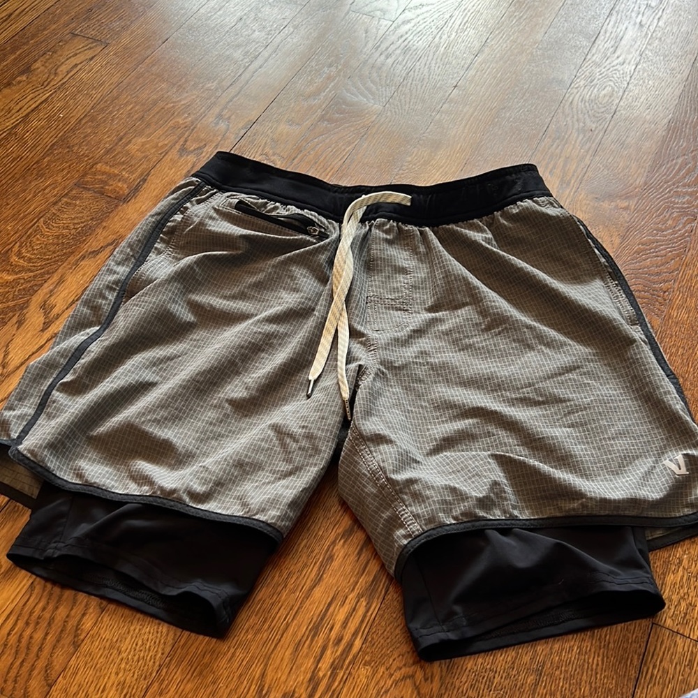 Vuori shorts with liner. Gray with black liner. Pocket on front and back.